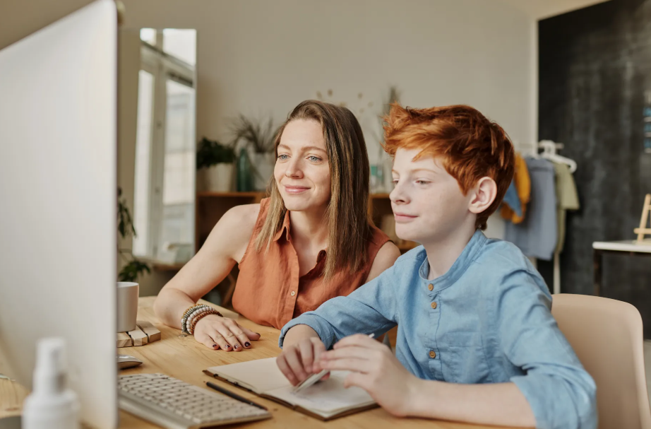 parent and kid on desktop